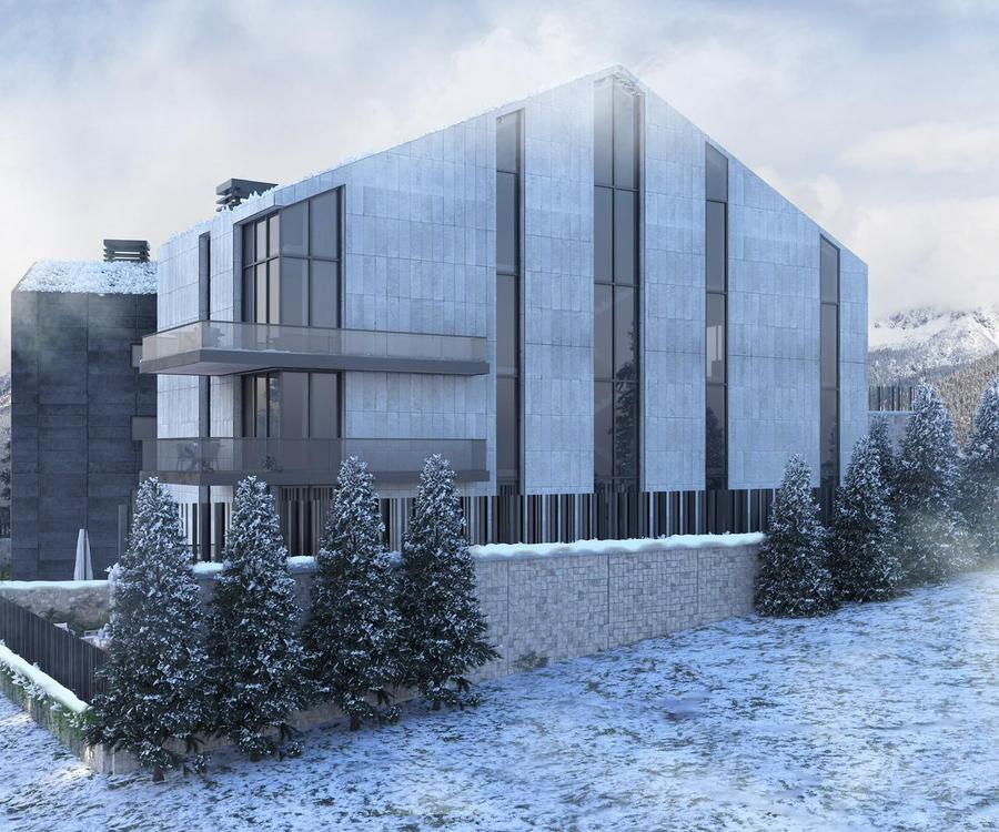 Faraya 2427 — winter view showcasing floor-to-ceiling glass facade and warm interior glow
